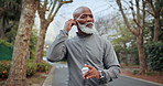 Serious, black man and earphones at park for fitness, exercise and streaming podcast for health. Senior person, runner and ready in nature with playlist audio, listen to music and physical activity