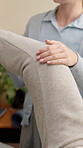 Physiotherapist, consultation and woman with leg exercise in clinic for recovery, wellness or health. Physical therapy, stretching and medical worker with patient for mobility rehabilitation.