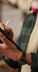 Carpenter, online and hands with tablet in workshop, manufacturing or planning for design on website. Warehouse, artisan and person with technology, woodworking and research for furniture production