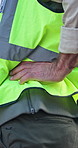 Architect, hands and injury with back pain on construction site for overworked pressure or discomfort. Male person, civil engineer or contractor with sore hip for building accident or fibromyalgia