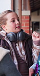 Talking, hallway and girl with friends at school for social development, conversation and learning. Happy, students and kids outdoor for chat, gossip and break for education, lesson and knowledge