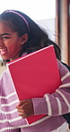 Laughing, student and child with book, school and happy for academic growth and discussion on break. Learner, walking and smile for education, learning and girl with funny gossip or conversation