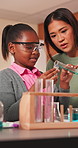 Science, teacher and children with chemical in classroom, learning or academic growth with education. Educator, advice and kids with safety glasses, woman and explaining chemistry lesson in school