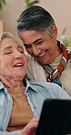 Tablet, mature and lesbian couple in home with laugh, bonding together and discussion for funny movie. Happy, lgbt women and talk in lounge with tech, relationship and humor for romantic comedy show.