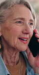 Mature, woman and smile in house with phone call, conversation and gossip update on weekend break. Happy, female person relax and tech in living room with contact, discussion and listen to feedback.