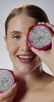 Beauty, dragon fruit and face of happy woman in studio for cosmetics, dermatology or gut health. Aesthetic, smile and vitamin c with person on white background for dietary fibre, skincare or wellness