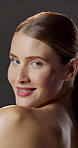 Face, laugh and woman with pride for skincare, studio background or hydration with cosmetic benefits. Portrait, wink and happy person with healthy skin, beauty and confident with dermatology in USA