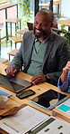 Meeting, laptop and business people in cafe with documents for investment planning with client profile. Happy, computer and team of financial advisors with paperwork for finance report in coffee shop