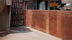 Closeup, machine and carpentry with wood for smooth finish in workshop, process and furniture manufacturing. Industrial jointer, tools or equipment with lumber in factory, woodworking and production