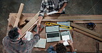 Carpenter, team and handshake in factory with paperwork, design update and agreement. Above, men and shaking hands at laptop for woodworking project, feedback and task delegation for productivity
