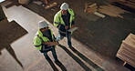 Team, above and walk in timber factory with conversation, blueprint and clipboard for carpentry project. Men, lumber yard and furniture manufacturing with happy discussion for carpenter partnership