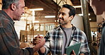 Men, handshake and carpenter team in warehouse with support, tech or happy for project development. Partnership, people and shaking hands in timber factory for collaboration, cooperation or feedback