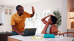 Education, remote work and son high five with father in home for business or learning. Computer, study and success with African family at apartment counter for freelance job or school achievement