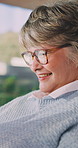 Smile, woman and laugh with tablet on sofa for social media, website and texting contact. Happy mature person, glasses and tech for communication, online notification and message update in house