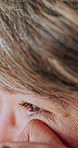 Sad, senior and woman with tear in home for past moment, memory loss or grief for loneliness. Emotional, widow or elderly female person wiping eye for reflection, nostalgia or mourning in house