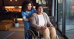 Nurse, woman and senior patient with wheelchair in retirement house for assisted living by window. Caregiver, healthcare worker or helping elderly female person with a disability in nursing home