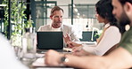Laptop, businessman or proposal with team in meeting, investment planning or project suggestion. Computer, discussion or manager in office for financial update, review or budget evaluation with notes