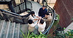 Business people, team building and stack hands at office for mission, goal celebration or solidarity. Group, above and clapping for success by stairs, cohesion or collaboration with achievement