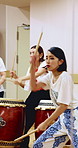 Taiko, art and women with drums for practice, rehearsal or learning cultural choreography. Bachi percussion, creative lesson and people in Japanese band for sound coordination, performance or rhythm.