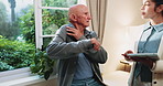 Physio, tablet and old man in consultation with exercise, discussion and medical research for healing. Elderly person, workout and physical therapist in clinic with tech, help or advice for recovery.