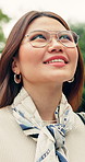 Thinking, calm and Asian woman in park with sightseeing, mindfulness and fresh air on summer break. Low angle, bokeh and happy person with insight, reflection and peaceful perspective on outdoor trip
