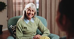 Therapist, discussion and old woman in consultation with smile, positive feedback and wellness update. Happy, senior person and conversation in office with counseling, good news or psychologist help.