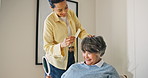 Support, haircare and senior mother with woman, grooming and bonding together in bedroom. Happy, adult daughter and elderly person with mirror, getting ready and hair styling assistance in house.