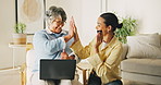 Credit card, laptop and high five with women in living room for online shopping, banking app help and ecommerce. Digital transaction, caregiver and celebration with fintech and mature person in home