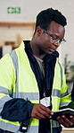 Tablet, talking and logistics worker in warehouse for research on cargo, distribution or delivery. Review, black man and supply chain manager with digital technology for order confirmation in factory
