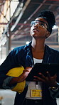 Woman, worker and inspection at construction site with tablet, research or review engineering design. Black person, walk and engineer with tech for infrastructure evaluation, online checklist and PPE