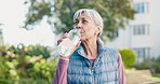 Fitness, drink water and senior woman outdoor for rest, workout recovery and wellness. Exercise break, hydration or person with bottle in city for health, electrolytes or mineral in active retirement