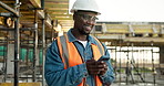 Builder, man and thinking on construction site with phone, smile and check social media app on break. Happy, black person and contractor outdoor with tech, PPE or reflection for text message response