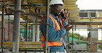 Phone call, black man and construction worker with communication from foreman for development. Scaffolding, tech or talking to contractor with update, renovation or building with smile outdoor at site