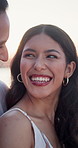 Couple, laugh and relax at beach with summer holiday, funny story and travel for romantic getaway. Flare, happy people dating and talk outdoor by ocean with love, relationship and joke for vacation.