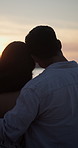 Love, back and couple hug at beach at sunset, support and romantic connection on vacation. Man, woman and embrace with ocean view on summer holiday, commitment and sightseeing with partner