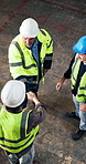 Above, architect and handshake in construction site with team, agreement and blueprint for meeting. Manager, people and shaking hands in building with design document, architecture deal or discussion