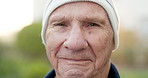 Wellness, face and old man in park with smile, fresh air and positive attitude on winter break. Confidence, space and senior person with cold weather, outdoor unwind and good mood in retirement.