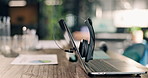 Empty, help desk and laptop with headset for customer service communication and contact us at call center. Hotline, advice or workspace with computer, audio technology and client support for telecom