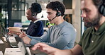 Call center, man and laptop with coworkers in office, contact us and communication with help desk. Person, coworking and talking at pc for online advice, customer support and telecom in workplace