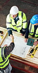 Above, carpenter and team with handshake for blueprint approval, manufacturing and deal in workshop. Woodwork, designer and people shaking hands in factory with planning, project or design agreement.