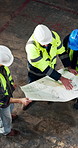 Above, engineer and team in warehouse with blueprint, collaboration or advice for industrial project. People, talk and design document for engineering, manager instructions and evaluation of layout.