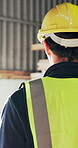 Woodworker, walking and man with helmet in factory, safety compliance and inspection for production. Woodworking, artisan and person with hard hat for protection, manufacturing and carpentry project