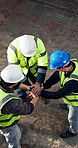 Construction, happy and men on site with handstack, team victory and motivation in building project. Above, clap and engineers with hands together, encouragement and success in industrial development