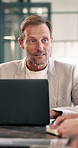 Meeting, business and man on laptop for planning, financial review and feedback for investment. Manager, computer and person with online report for finance, discussion or research for budget proposal