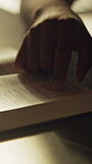 Faith, worship or hands with bible in home for religious study, spiritual growth or word of God. Guidance, person or reading scripture in Holy book for christian wisdom, praise or learning the gospel