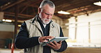 Reading, man and carpenter with tablet in workshop for research on furniture manufacturing with order. Digital technology, quality control and mature woodworker with checklist for timber project.