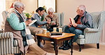 Nurse, puzzle and senior people in nursing home for help with game, word search and book activity. Retirement, timelapse and elderly man and women with caregiver for answer, crossword and solution