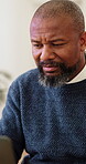 Happy, businessman and ideas with laptop in office, research and reading financial report on website. Mature accountant, typing and black person with technology for budget review and reflection