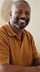 Smile, relax and face of black man in home for break, calm and peaceful weekend in morning. Happy, confident and portrait of mature person with pride for positive attitude in living room at house.