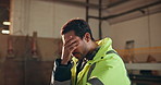 Man, carpenter or phone with headache for stress, supplier issue or distribution mistake in warehouse. Frustrated, male person or contractor with smartphone, helmet or migraine for delivery inflation